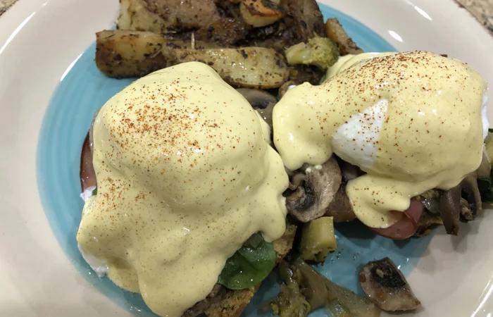 Eggs Benedict with skillet potatoes